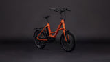 CUBE Compact Hybrid 545 rust orange compact electric bike in studio