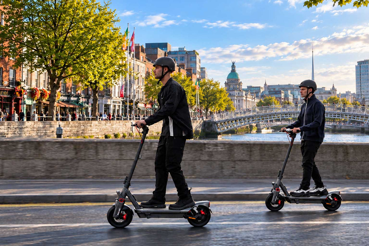 Two scooter riders beside the River Liffey