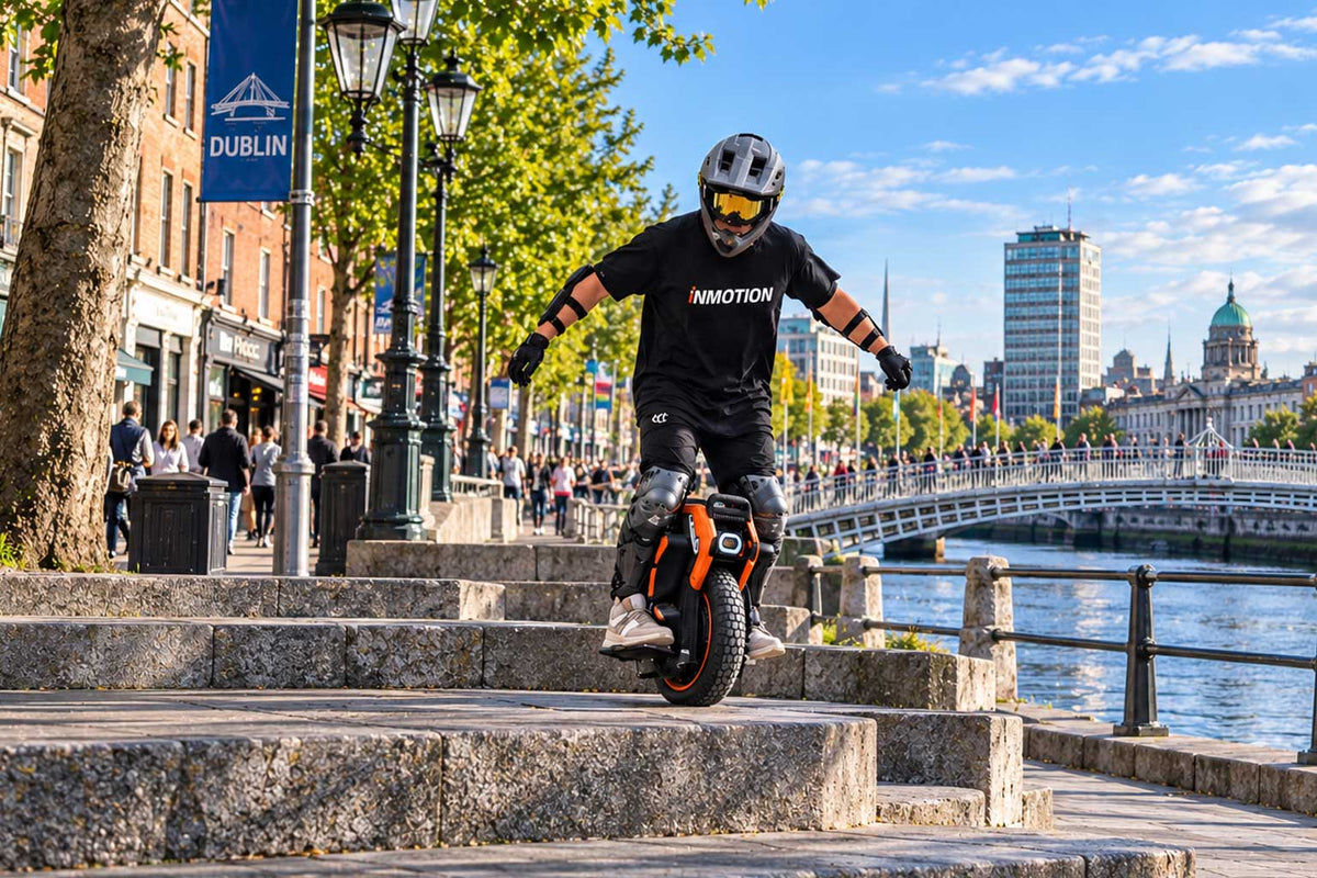 Electric unicycle rider wearing protective equipment